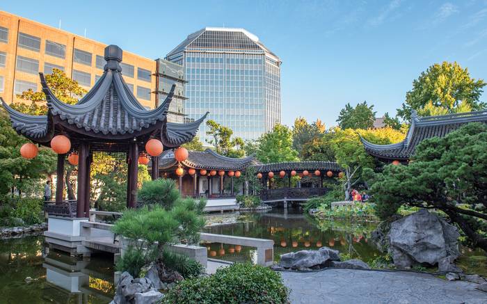 Pavilions and lantern-hung walkways around the lake at Lan Su Chinese Garden