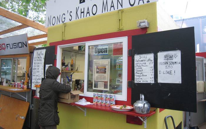 The Nong's Khao Man Gai cart with its menu boards and order window