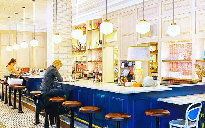 The blue-tiled counter and pendant lights inside Screen Door in the Pearl District