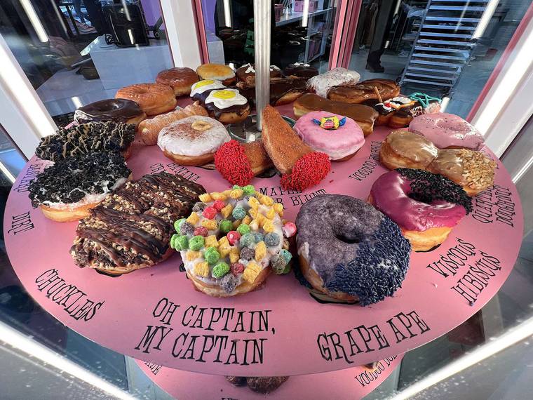 A rotating display of decorated doughnuts at Voodoo Doughnut