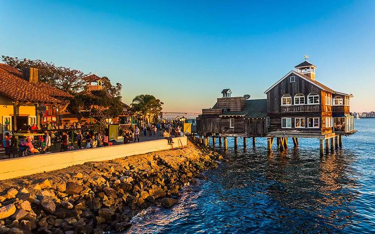 Seaport Village on the bay at sunset with its timber pier building