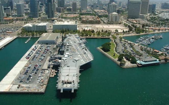 The USS Midway moored at Navy Pier with the downtown San Diego skyline behind